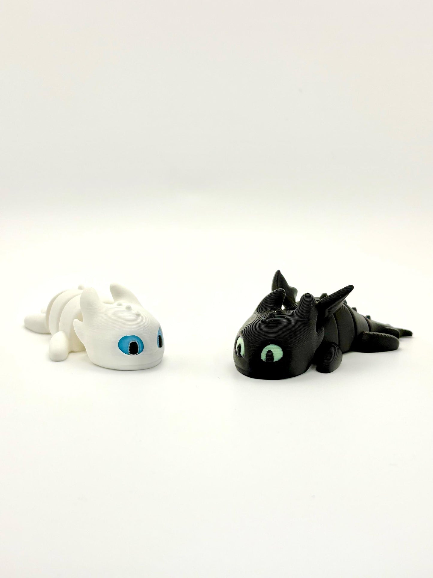 Baby Toothless Light Fury Fidget Toy with glow eyes